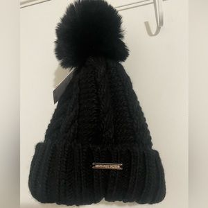 Michael kors women faux-fur—Pom cable- knit beanie. it’s new